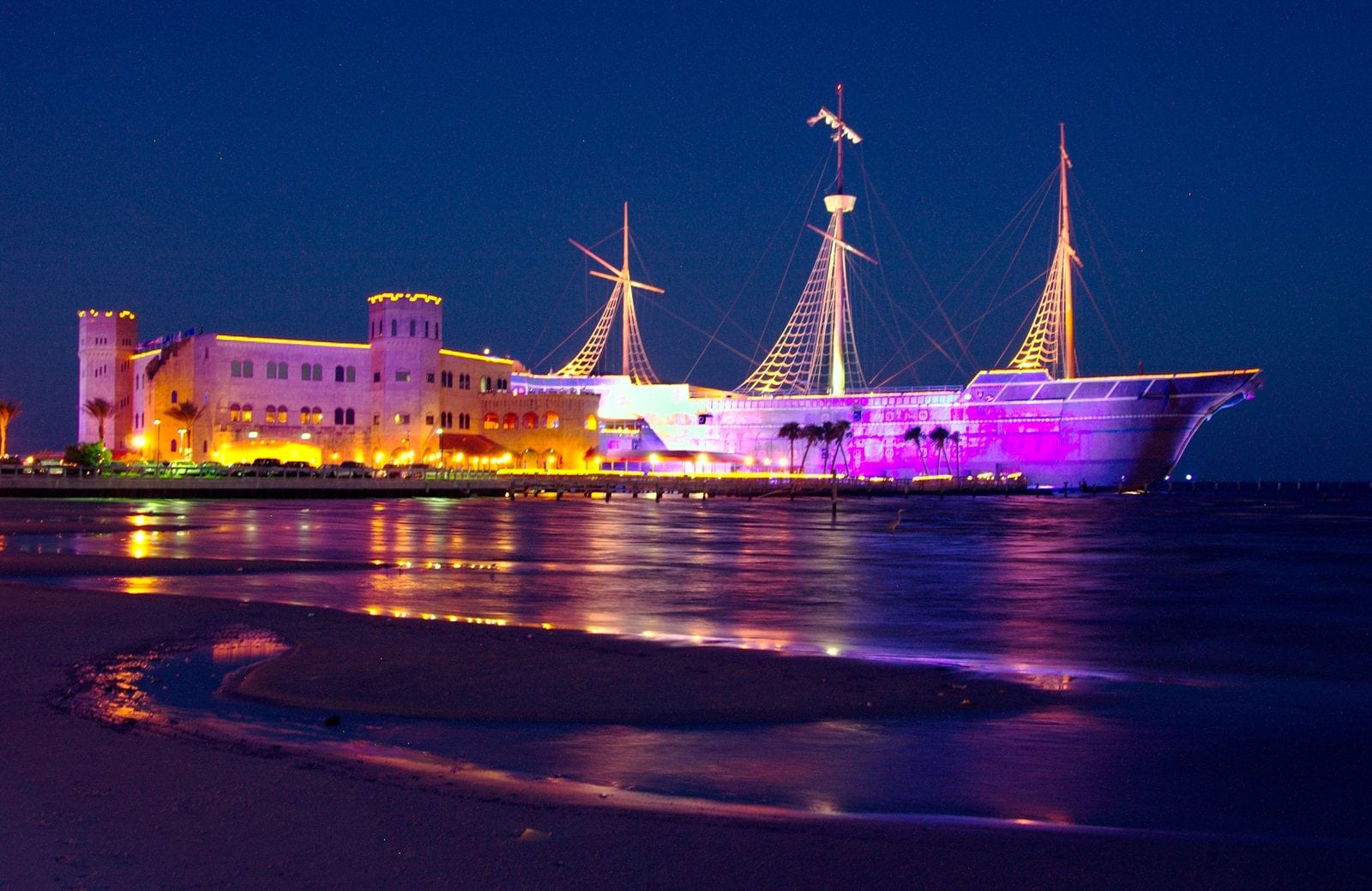 Treasure Bay Casino pirate ship lit up at night on the Biloxi beach